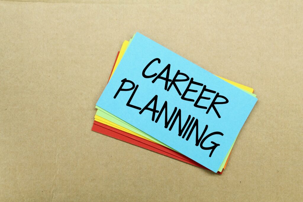 Colorful sticky notes labeled “career planning” on a desk.