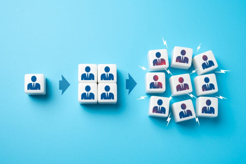 Blocks representing team growth illustrate how to improve customer retention through stronger engagement and scalable support.